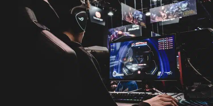 person sitting on gaming chair while playing video game